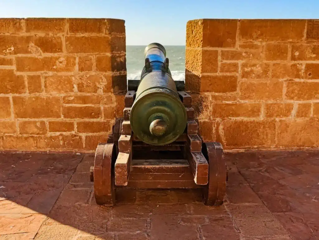 View of a cannon that sits on the brick wall of the Old Scala in Essaouira.