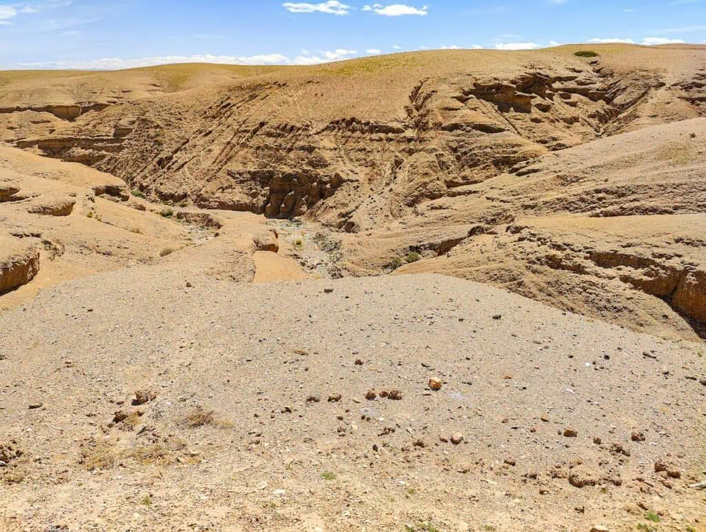 View of the golden dunes of the Agafay Desert during one of the best Agafay Desert tours.