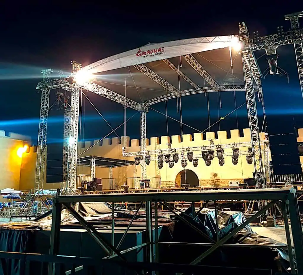 View of the stage in front of the city walls at the Gnaoua Music Festival in Essaouira in the evening.