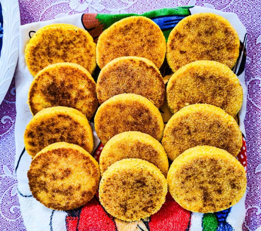 Aerially view of round, yellow pieces of harsh on a plate, They sit in three rows on a plate and each row has four in it. I made them during the best cooking class in Marrakech.