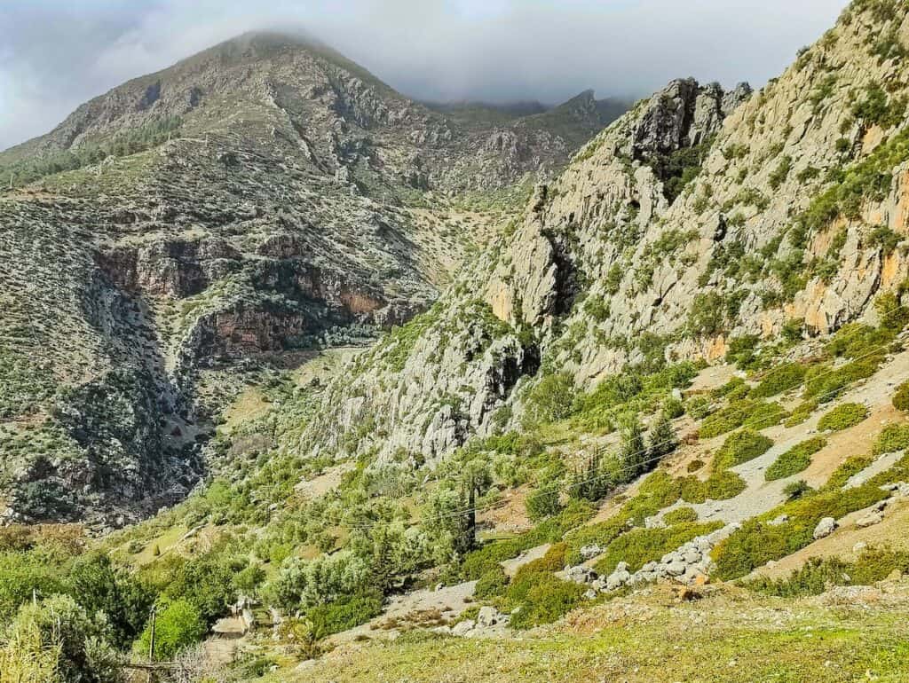 View of the mountains with rocks and greenery in and around Chefchaouen.