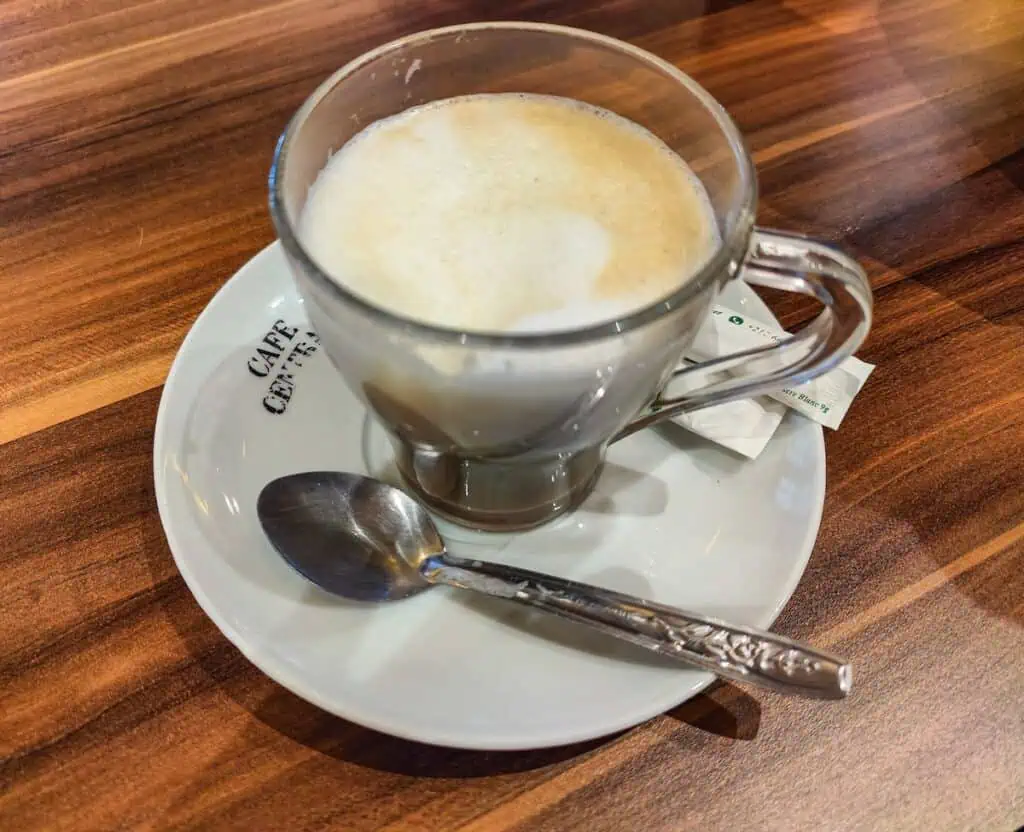 View of a latte at Gran Cafe on a table.